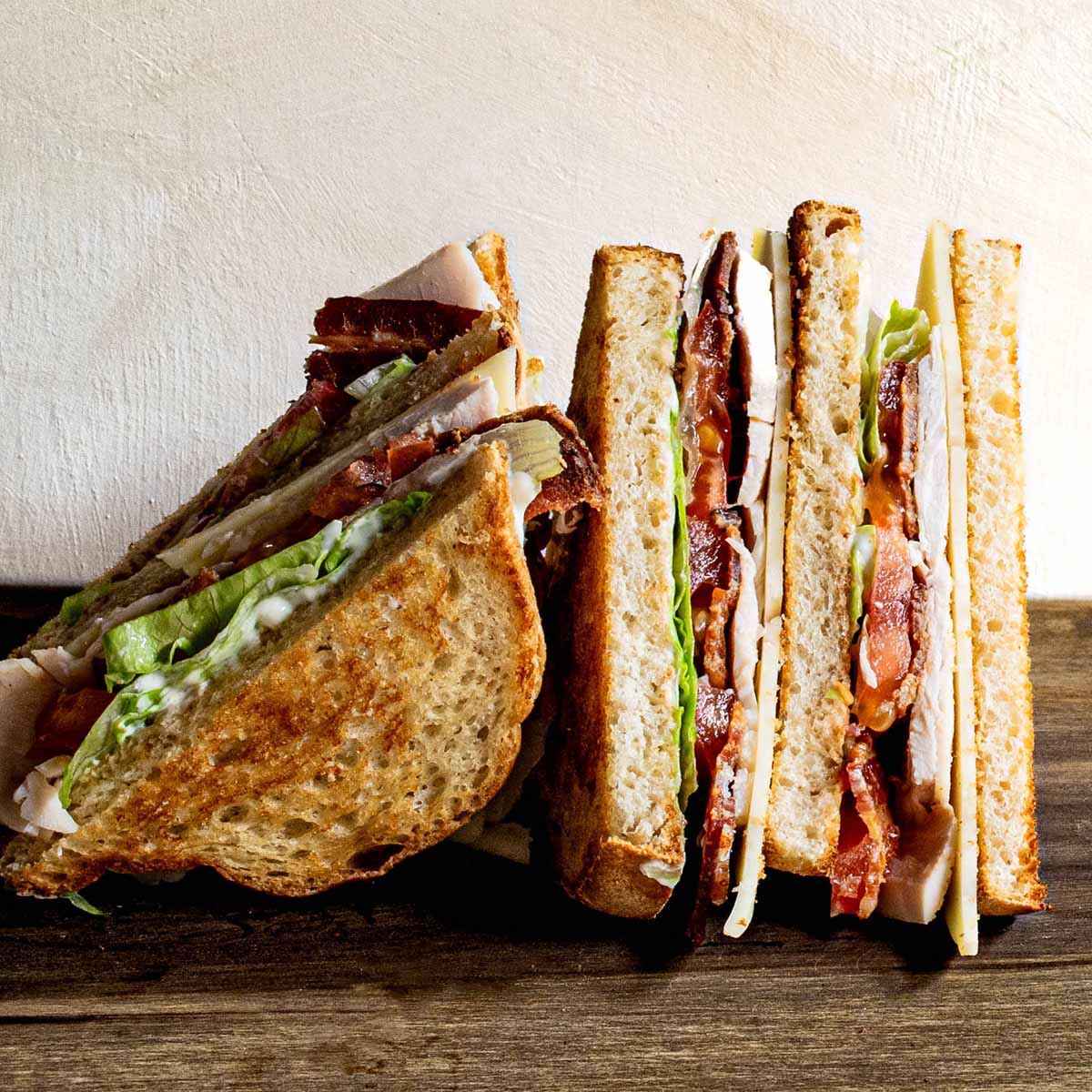 Club sandwich held together with a toothpick in each triangle.