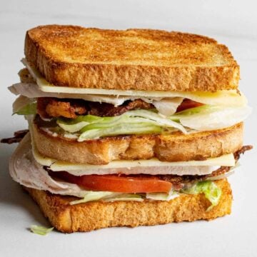 How to make and layer a club sandwich so ingredients don't slip out.