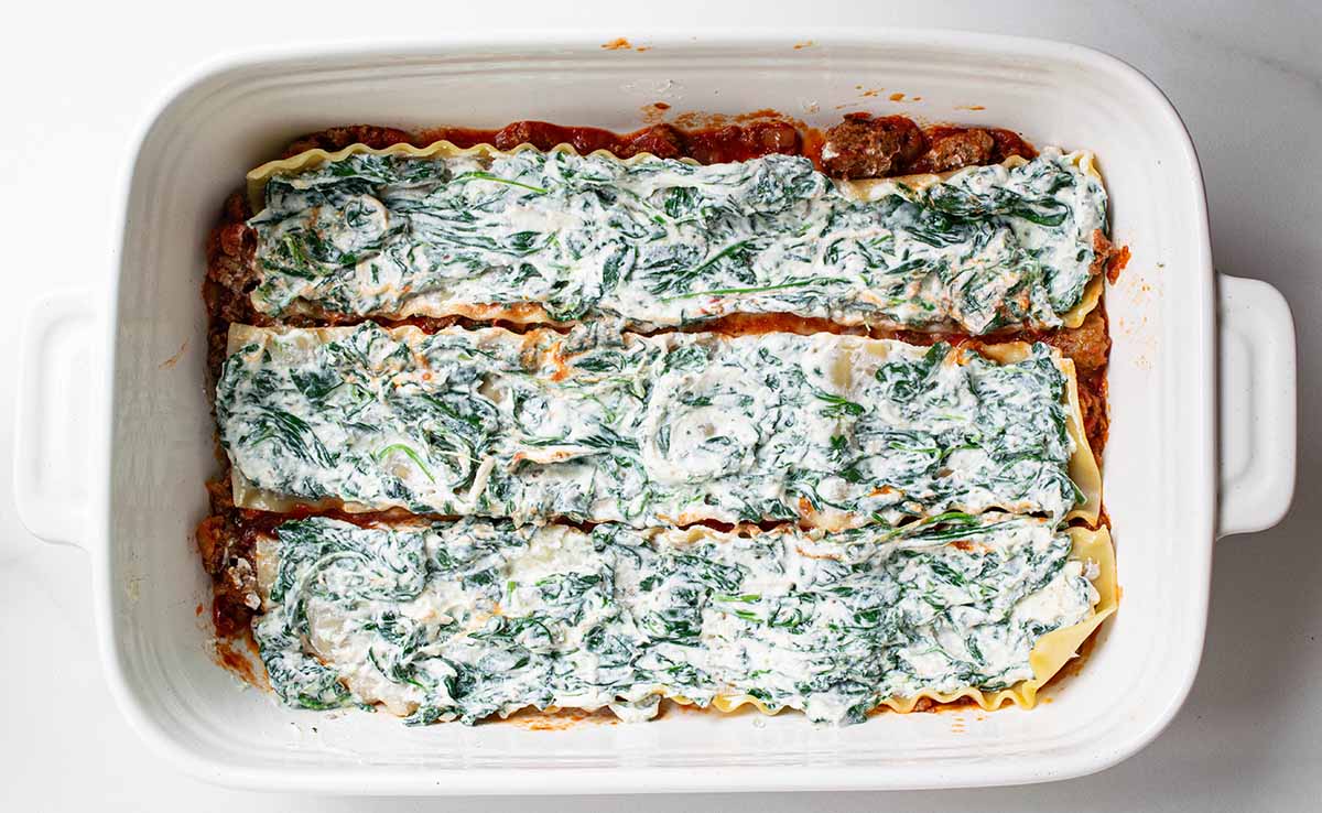 Lasagna layers: sauce on the bottom, then noodles, and top the noodles with ricotta cheese.