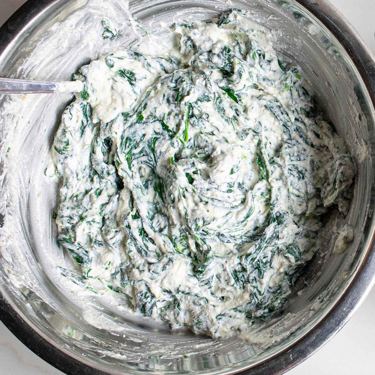 Ricotta and spinach mixture before spreading on the lasagna roll ups.