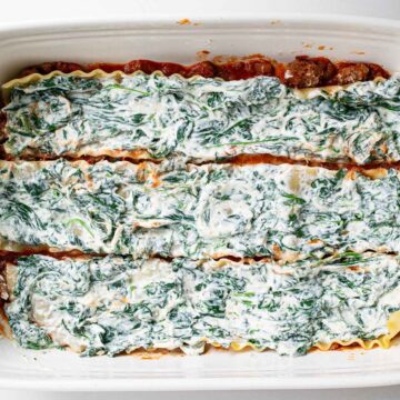 Layers of lasagna show the proper order: noodles, ricotta, mozzarella, then sauce.
