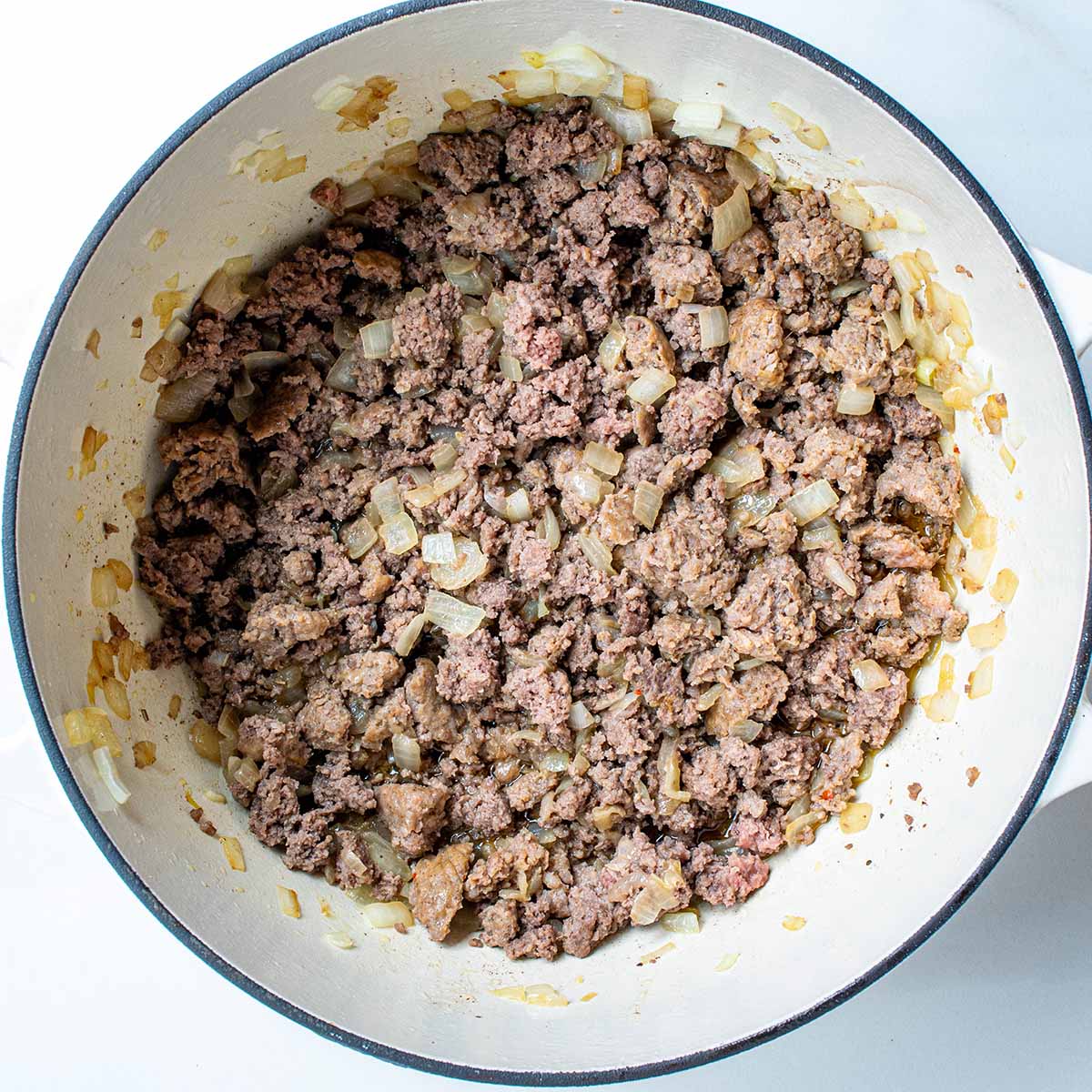 Ground sausage and beef mixture for a homemade meat sauce for lasagna.